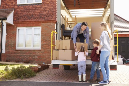Professional furniture pick-up team preparing for storage in Finsbury Park