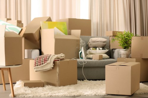 Professional movers handling office equipment
